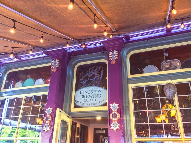 purple decor around entrance to on brewery