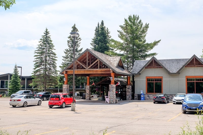 large lodge building at hidden valley resort with parking lot in front