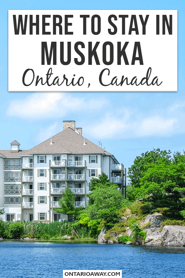 Photo of white hotel with green trees next to it and water in foreground with text overlay where to stay in muskoka