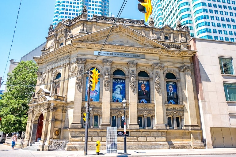 old white stone building on corner of intersection in toronto.