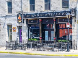 iron duke pub entrance with chairs on patio in kingston ontario