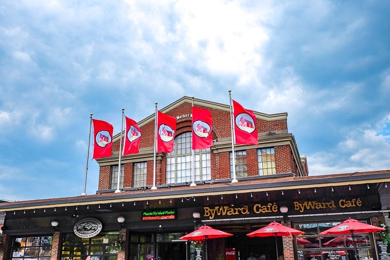 red flags on entrance to byward market red brick building