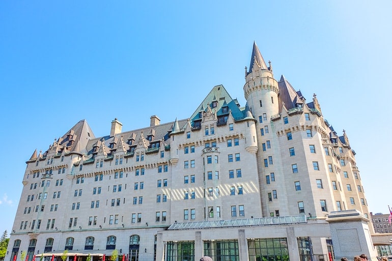 large castle looking hotel with clear blue sky behind