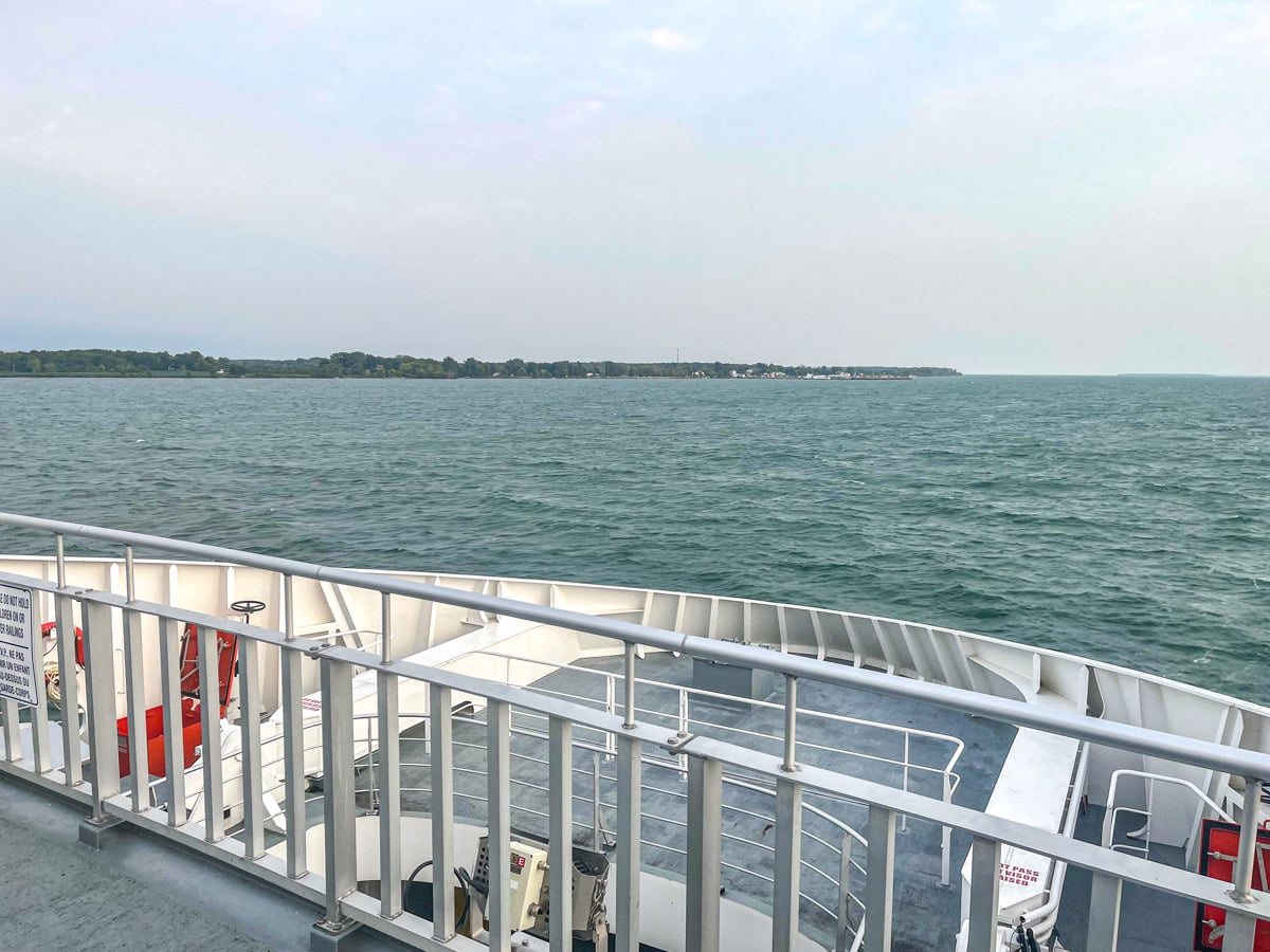 pelee island as seen from the top deck of the ferry with open lake ahead.